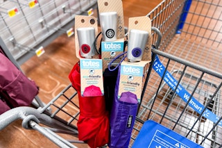 3 umbrellas in a cart