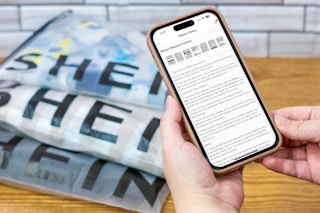 someone looking at the Shein return policy on their phone