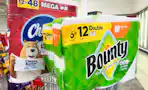 charmin toilet paper and bounty paper towels on a cart