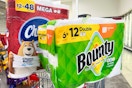 charmin toilet paper and bounty paper towels on a cart