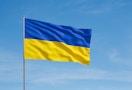 Ukrainian flag with a blue sky behind it