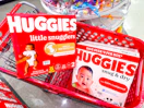 two boxes of huggies diapers in a shopping cart at Target