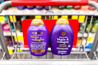 two bottles of ogx hair care in a shopping cart