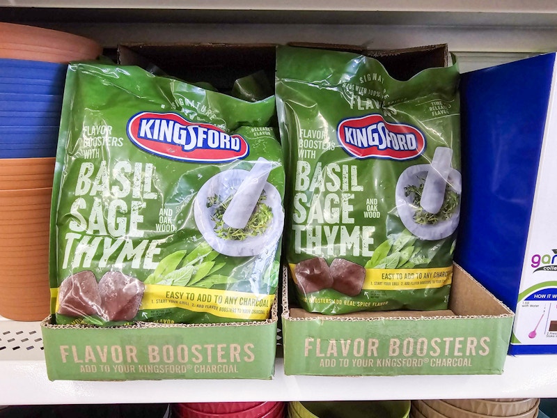 bags of kingsford flavors charcoal on a shelf