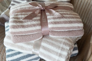 stack of barefoot dreams blankets