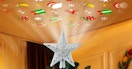 a star Christmas projector on top of a Christmas tree