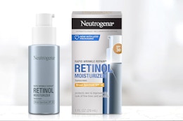 a pump bottle of moisturizer next to its packaging 