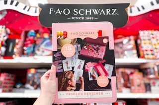 hand holding a fao schwarz fashion designer art set at target