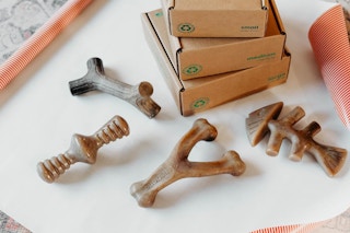 dog toy bones next to boxes