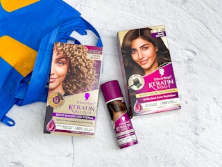 two boxes of schwarzkopf hair color and root spray on counter