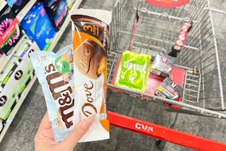 hand holding m&m's and dove in front of cvs shopping haul