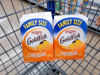 Two 10-ounce packages of cheddar flavored Goldfish in Walmart shopping cart