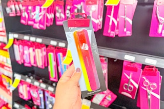 person holding a pack of nail files