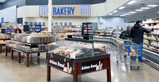 The Walmart bakery area with some customers shopping