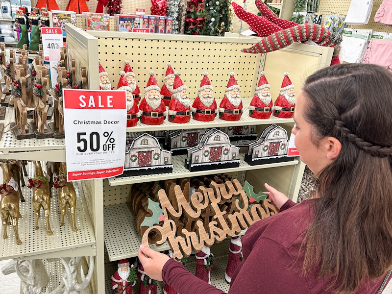 a person shopping 50 percent off christmas decor in hobby lobby