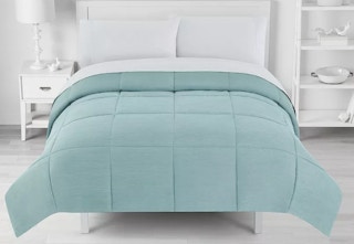 Teal blue Kohl's Big One Comforter in a bedroom. 