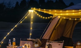 string lights over a campsite 