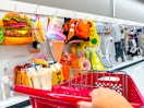 target cart parked in front of halloween costumes sitting on a shelf