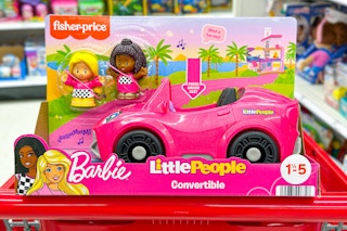 barbie little people convertible sitting on top a target cart