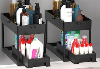 A pack of two organizers with personal care and cleaning supplies inside