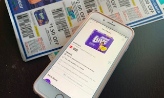 Phone showing Luvs cash back with Luvs paper coupons