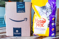 a bag of cat food next to an Amazon box