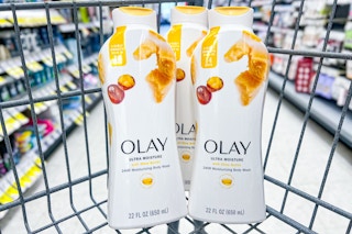 three bottles of olay ultra moisture body wash in a shopping cart