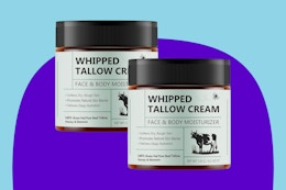 Uruses 2PCS Beef Tallow for Skin on a blue background.