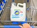 white bottle of all Free + Clear laundry detergent in a Walmart cart