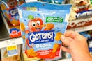 hand holding a pack of gerber get 'ems snacks