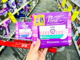 hand holding poise pads in cvs