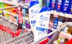 2 bottles of head and shoulders shampoo in a cart