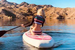 a woman on an inflatable paddleboard