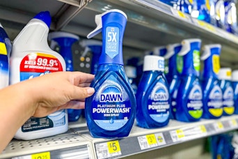 hand holding dawn powerwash dish spray next to store shelf