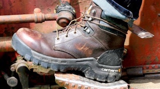 someone wearing carhartt boots