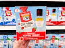 A hand holding a box of Horizon Organic Growing Years Lowfat Yogurt at Target