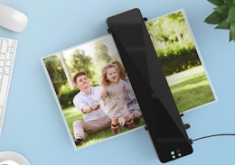 a laminator machine laminating a photo