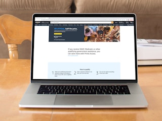 a macbook with the amazon prime discount page pulled up