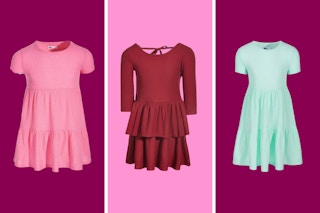 epic threads kids dresses arranged on a pink background