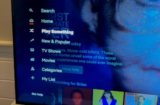 tv screen showing the netflix app open and the option to "play something" selected from the left menu