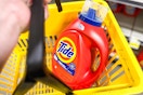 tide laundry detergent in a yellow shopping basket