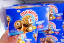 hand holding a box of nestle drumstick cones