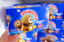 hand holding a box of nestle drumstick cones