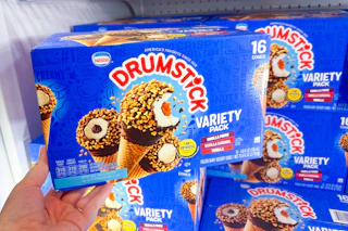 hand holding a box of nestle drumstick cones