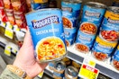 hand holding progresso soup at dollar general