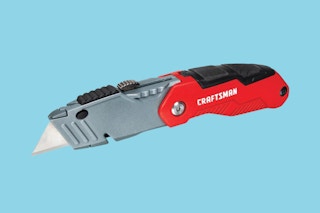 Craftsman read utility knife on a light a blue background