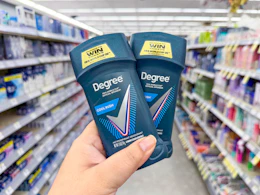 hand holding degree men deodorant in walgreens