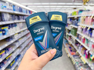 hand holding degree men deodorant in walgreens