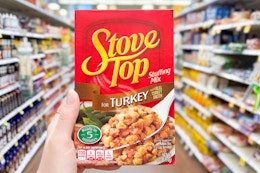 hand holding a box of stove top stuffing