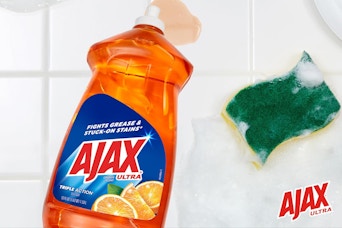 Ajax Dishwashing Liquid being used on counter